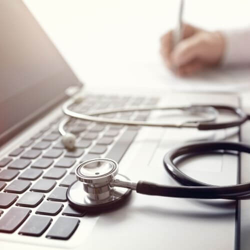 doctor-writing-prescription-or-medical-examination